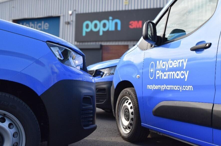 Blue cast vinyl vehicle wraps on company vans