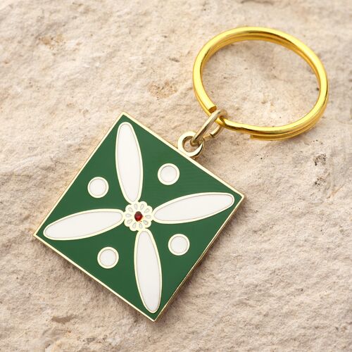 Charm. The Persian Cross. White on Green with 1 Central Red Stone.