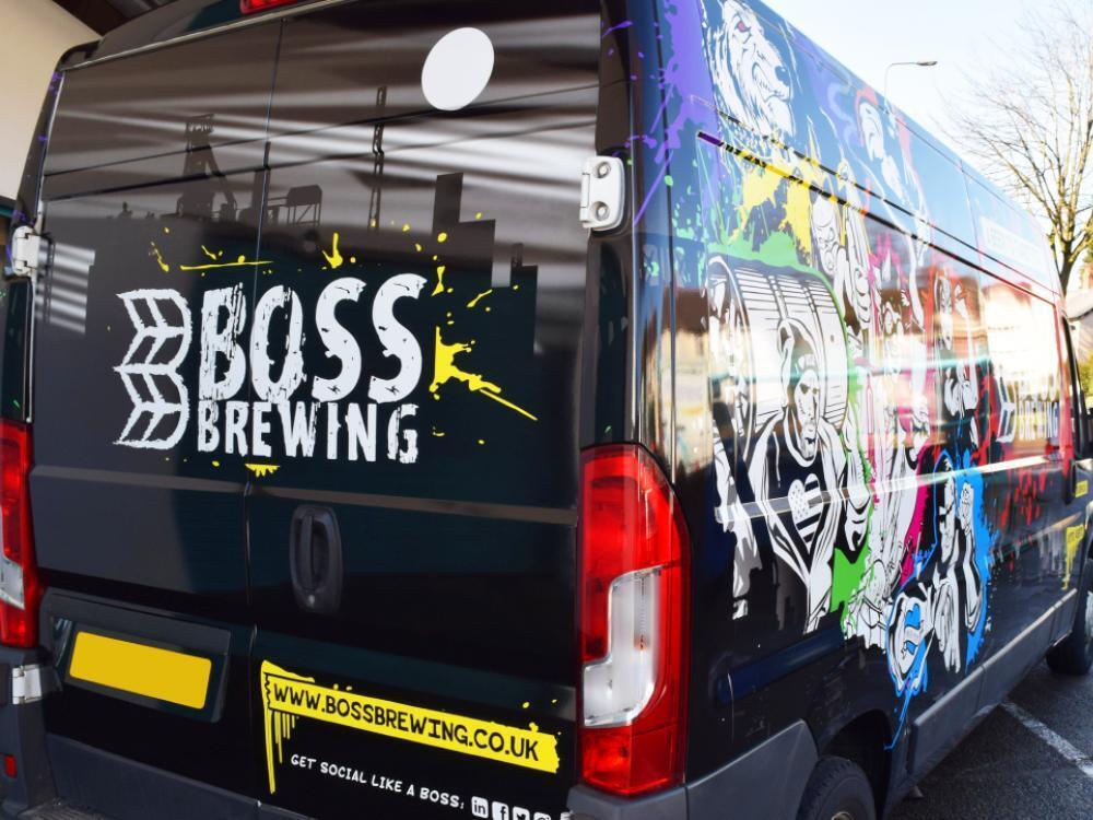 Branded company van wrap on rear end of a Peugeot Boxer vehicle.