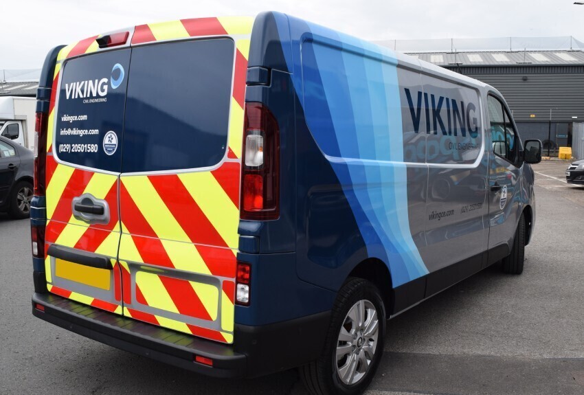Reflective safety markings on a company van.
