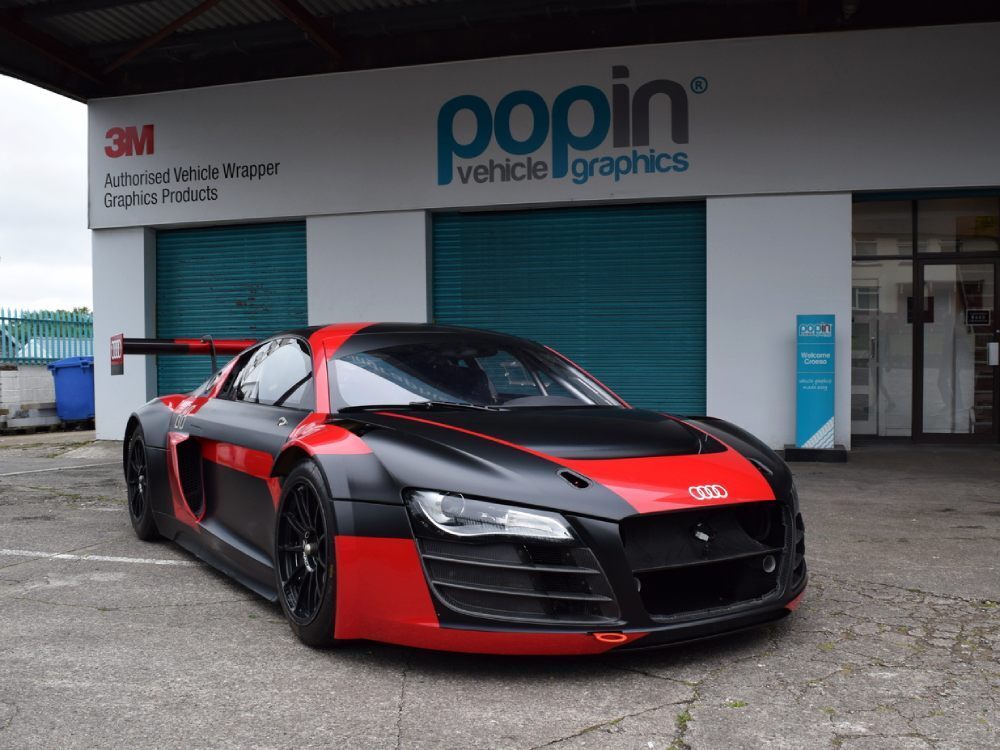 Company owned Audi R8 LMS with wrap and graphics outside Popin Cardiff.