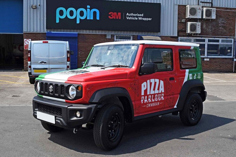 Suzuki Jimny company car with Pizza Parlour branded wrap and graphics outside Popin in Cardiff.