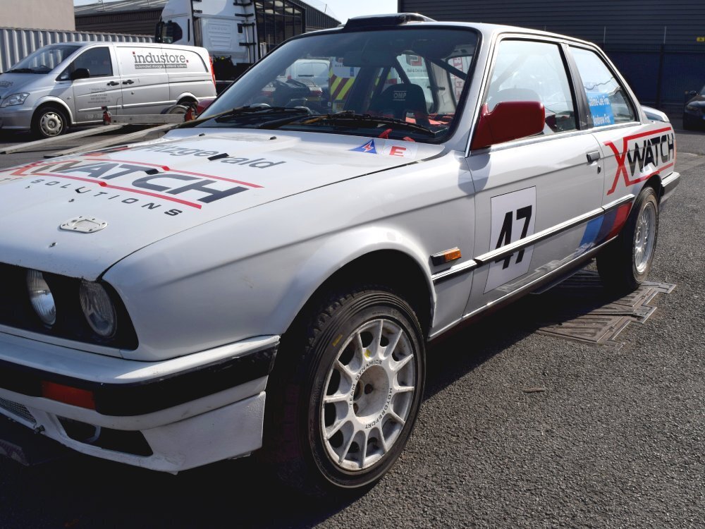 Race vinyl graphics on a BMW E30 rally car