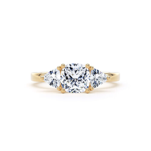Cushion and trilliant cut diamond trilogy ring
