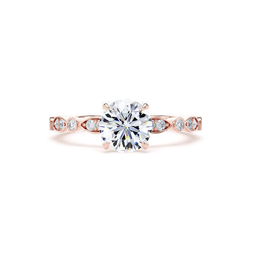 Round brilliant solitaire with fancy shaped shoulders