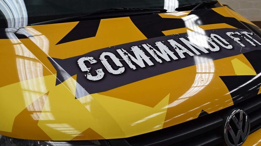 Yellow gloss vinyl wrap with high shine gloss finish branding on Volkswagen company van.