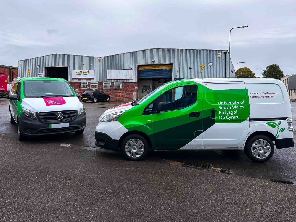 Matching partial vehicle wraps and graphics on fleet of Nissan ENV200 vans for University of South Wales.