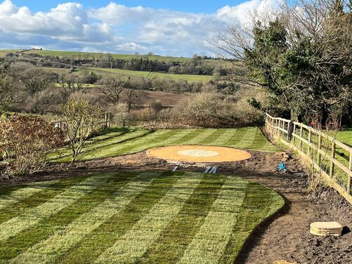 Newly laid turf. Striped lawn. Landscaping in Dorchester