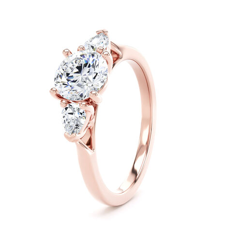 Round and pear diamond trilogy ring