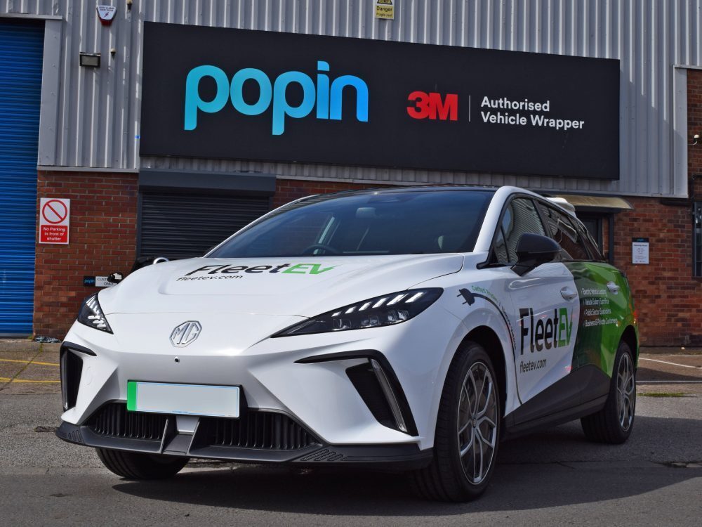 MG4 Trophy Long Range with FleetEV branded partial vehicle wrap and graphics outside Popin in Cardiff.