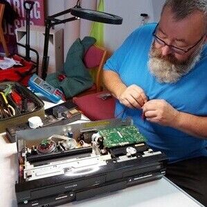 Repair Hub volunteer working on electrical items