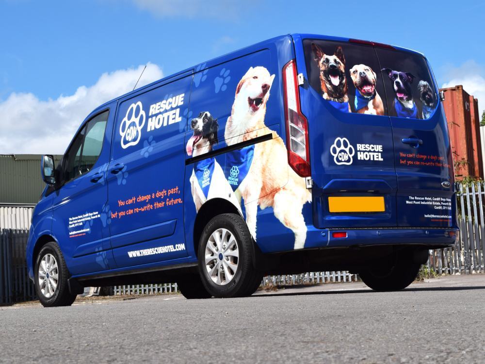 Company branded The Rescue Hotel vehicle wrap on Ford Transit Custom van.
