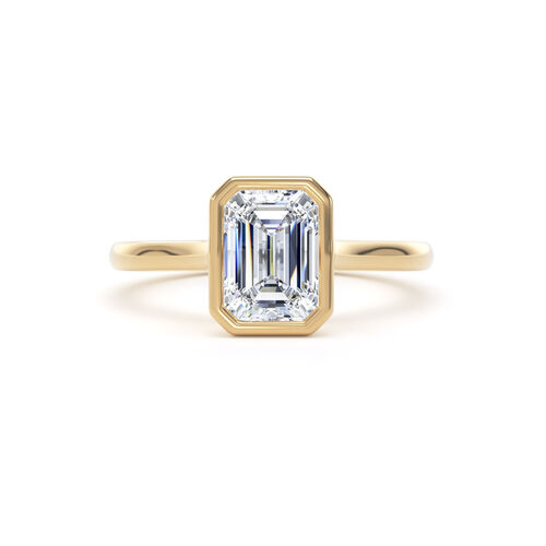 Emerald cut rubover diamond solitaire