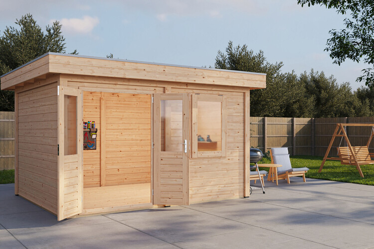 A small Lugarde select log cabin with a modern, rectangular design sits on a paved area in the backyard. It features two glass doors. Nearby, there is a patio set with a table, chairs, grill, and swing in the background, framed by a wooden fence and trees.