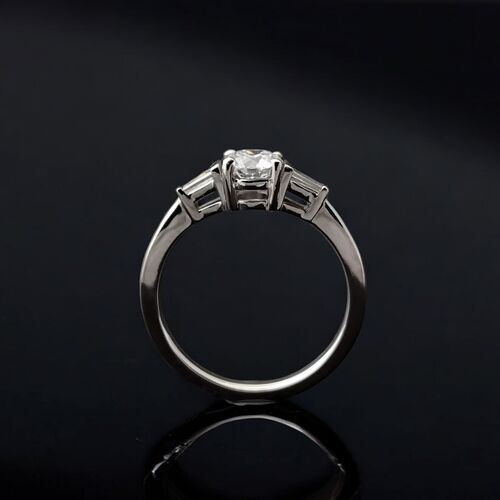Round diamond and tapered baguette trilogy ring in Platinum
