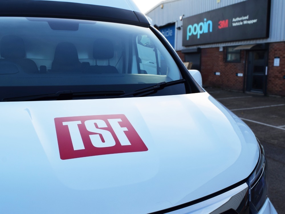 Vinyl van graphics on front bonnet of Nissan Primastar outside Popin in Cardiff.