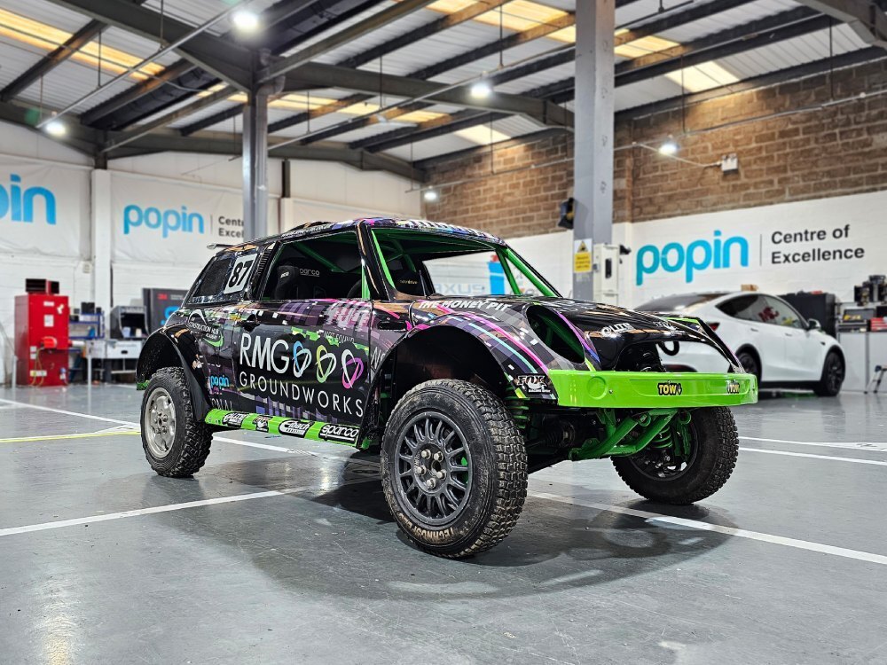 Vibrant motorsport livery and graphics on Mini Cooper V6 rally car