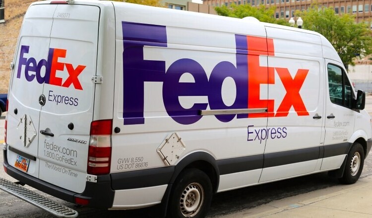 FedEx vinyl graphics on delivery van.
