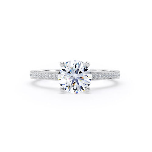 Round brilliant solitaire with mille-grain diamond set shoulders