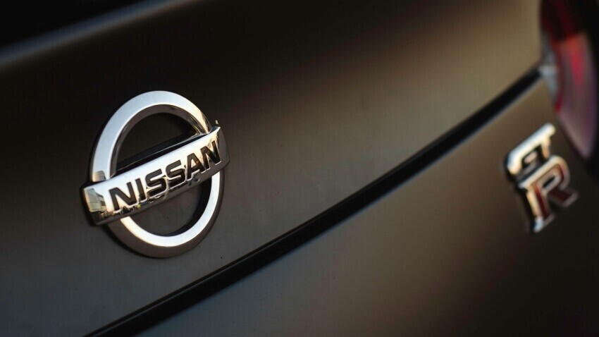 Nissan motorsport badge on rear of black race car