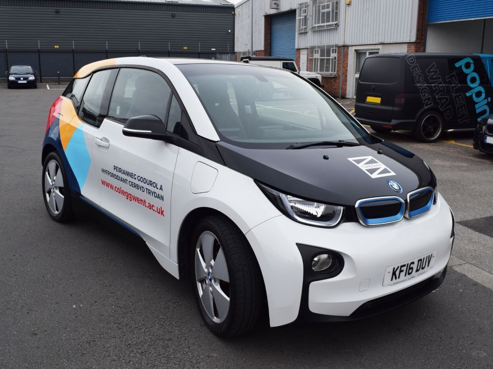 Company branded car wrap and vinyl graphics on BMW i3.
