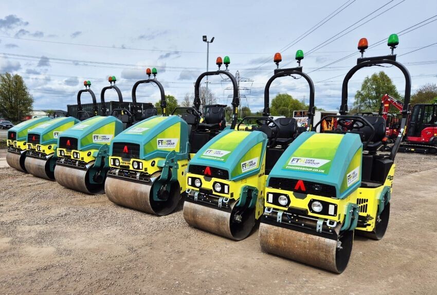 Fleet of plant machinery equipment with matching branded vinyl graphics.