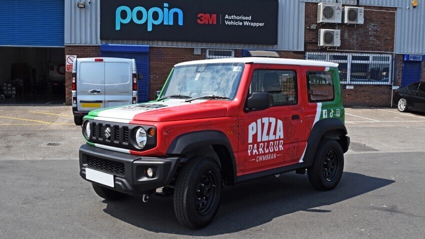 Suzuki Jimny company car with Pizza Parlour branded vehicle wrap outside Popin Graphics in Cardiff.