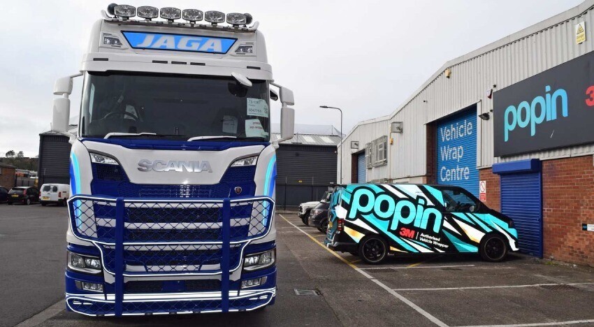 Scania lorry with newly installed vehicle livery and vinyl graphics outside Popin in Cardiff.