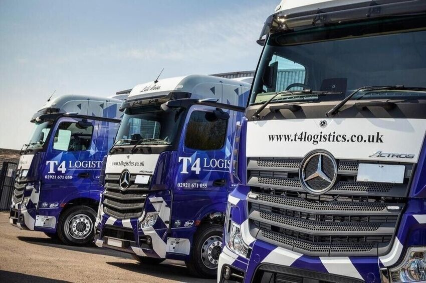 Professionally branded fleet of trucks with consistent livery.