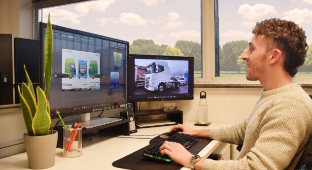 Vehicle vinyl graphic designer at work.