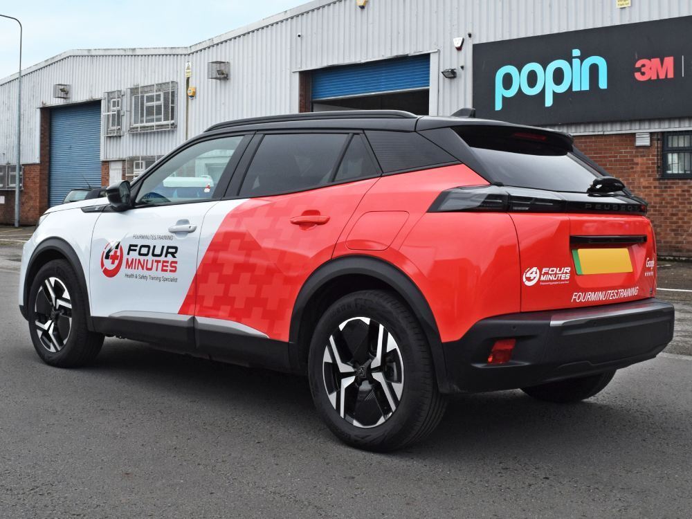 Partial vehicle wrap on Peugeot 2008 company car.
