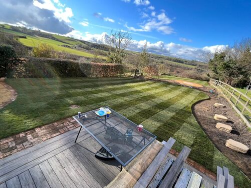 Newly laid turf. Striped lawn. Landscaping in Dorchester