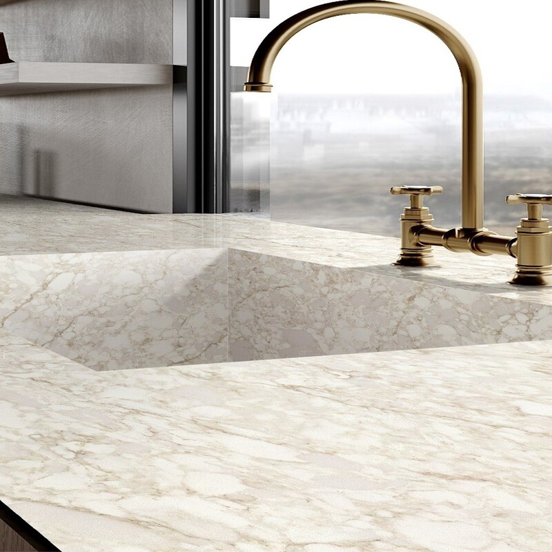  iStone Summer Hill is a part of the RT Stone range of quartz surfaces. A grand, granite-inspired worktop with a white and dark cream background. Furthermore, it features a cream veining that meanders through the surface of the stone, creating unique patterns throughout. White-coloured cabinets and cream decor would be best paired with this worktop because it’s bold enough to be the focal point of the room.  I must say I have seen a few kitchens done with this material, the customers were shocked, I was proud.....this is our best seller for a reason...it looks amazing, it looks lie the real Taj Mahal...  This colour is available in:  Jumbo - 323 cm x 163 cm