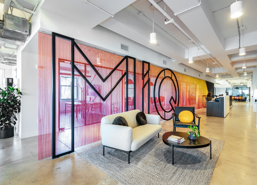 New York Office Reception are with a bespoke Chain Curtain and a Large handmade steel Logo also with a soft seating area