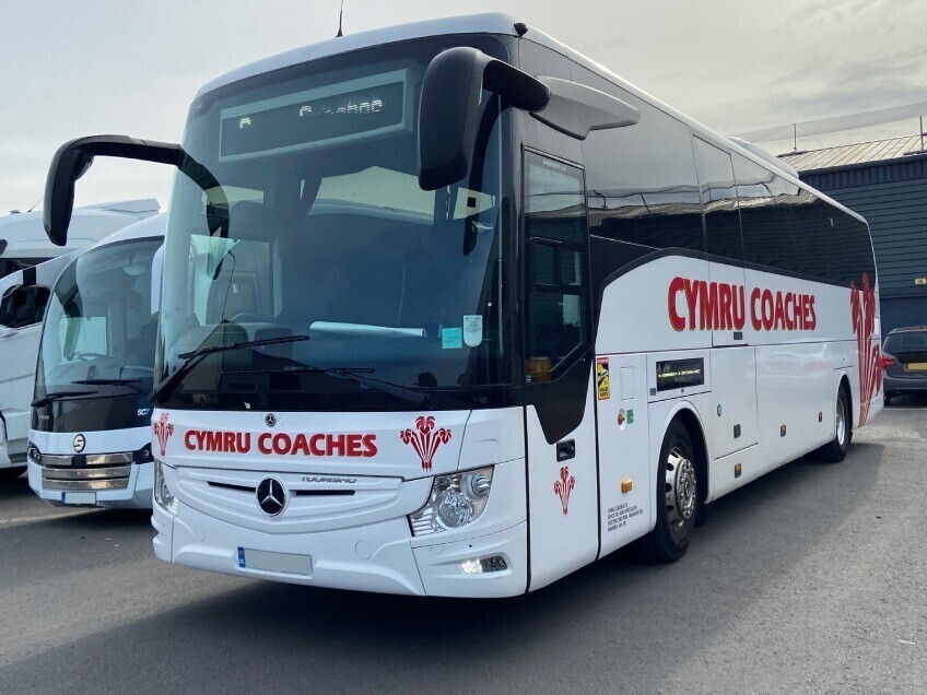 Coach from a fleet with a newly installed vehicle wrap and graphics.