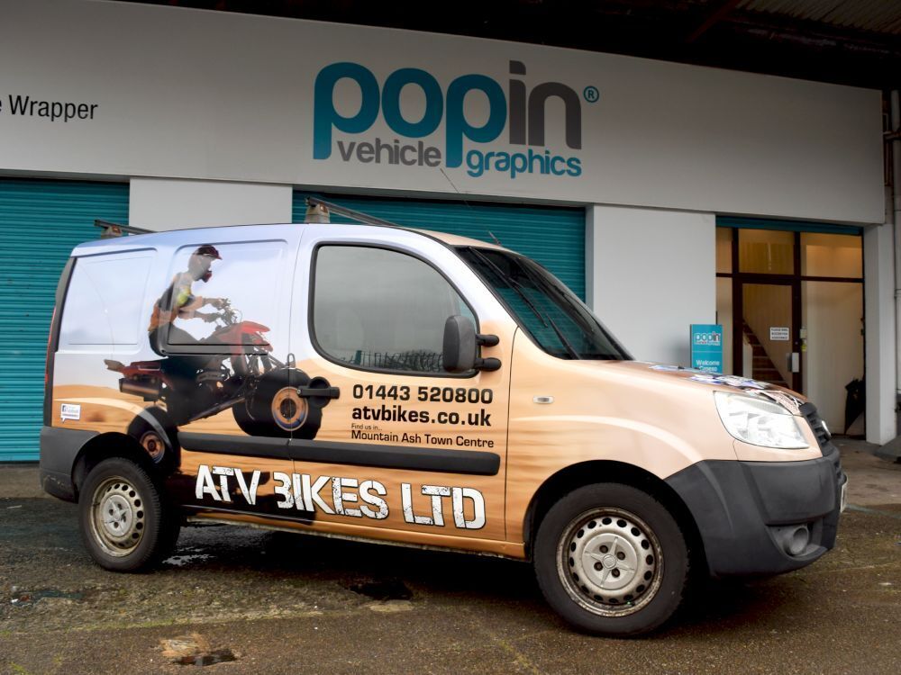 Striking full vehicle wrap on a company Fiat Doblo Cargo van.