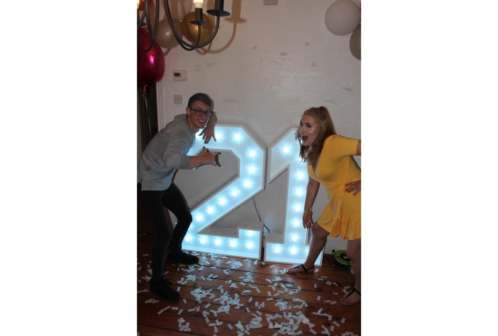Light Up 21 Numbers, man and woman either side