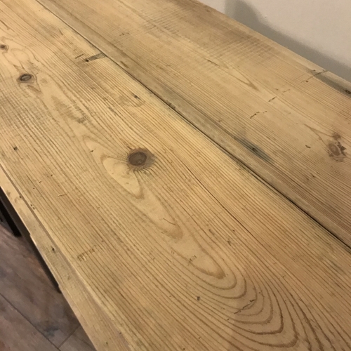 Reclaimed wood shelves with handcrafted metal tubular legs