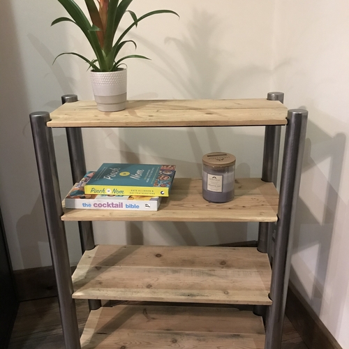 Reclaimed wood shelves with handcrafted metal tubular legs