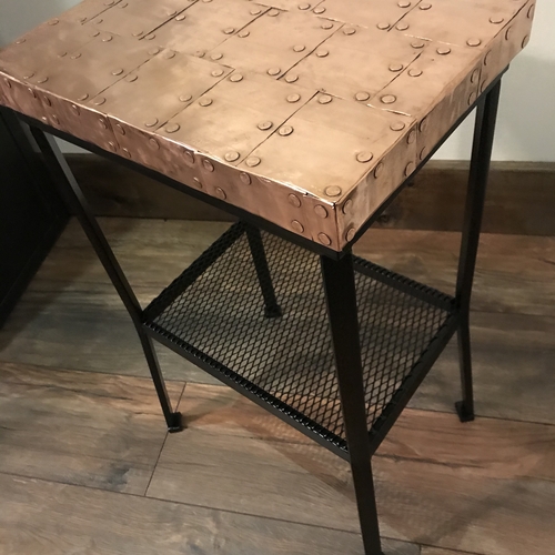 Small copper top table with black painted legs