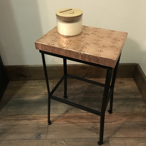 Small copper top table with black painted legs