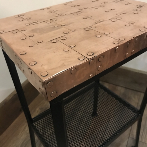 Small copper top table with black painted legs