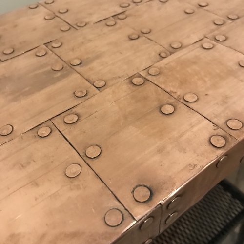 Small copper top table with black painted legs