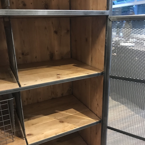 Large industrial metal mesh cupboard