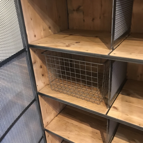 Large industrial metal mesh cupboard
