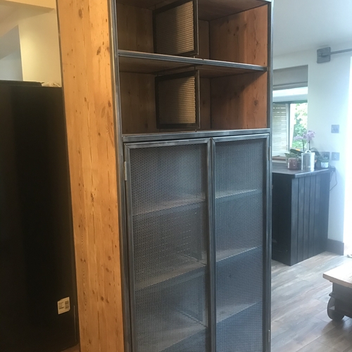 Large industrial metal mesh cupboard