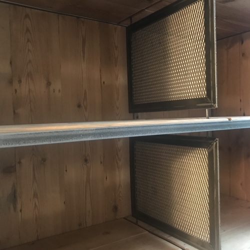 Large industrial metal mesh cupboard