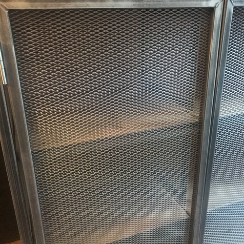 Large industrial metal mesh cupboard