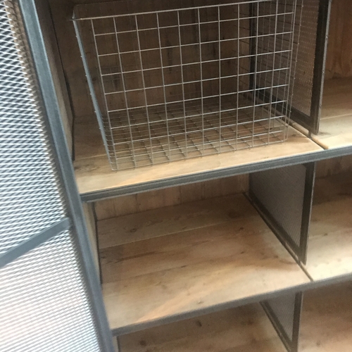 Large industrial metal mesh cupboard
