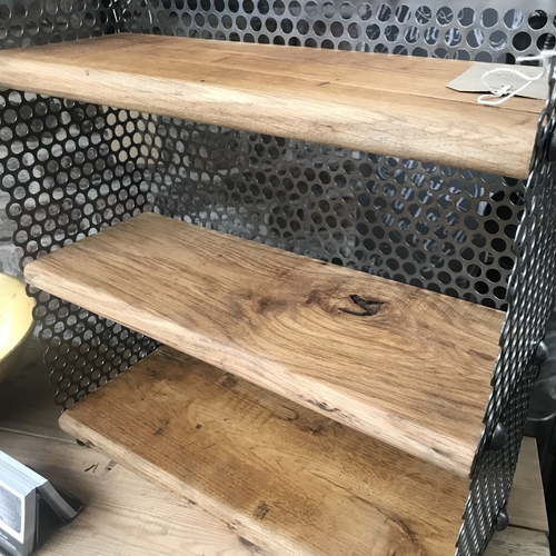 Small reclaimed shelves with perforated mesh design detail